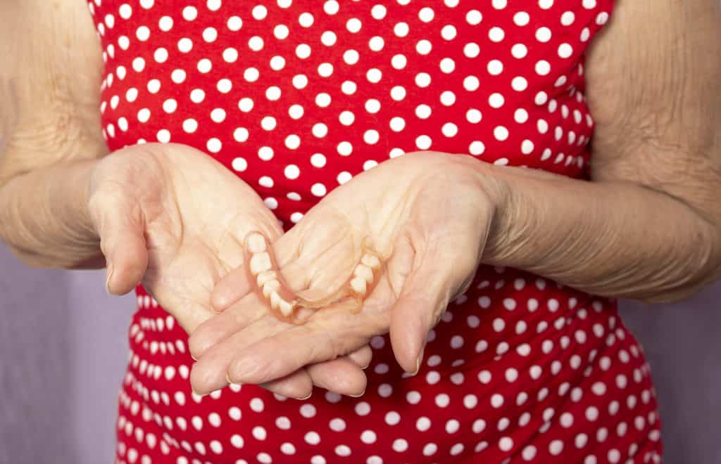 Lady Holding Partial Denture