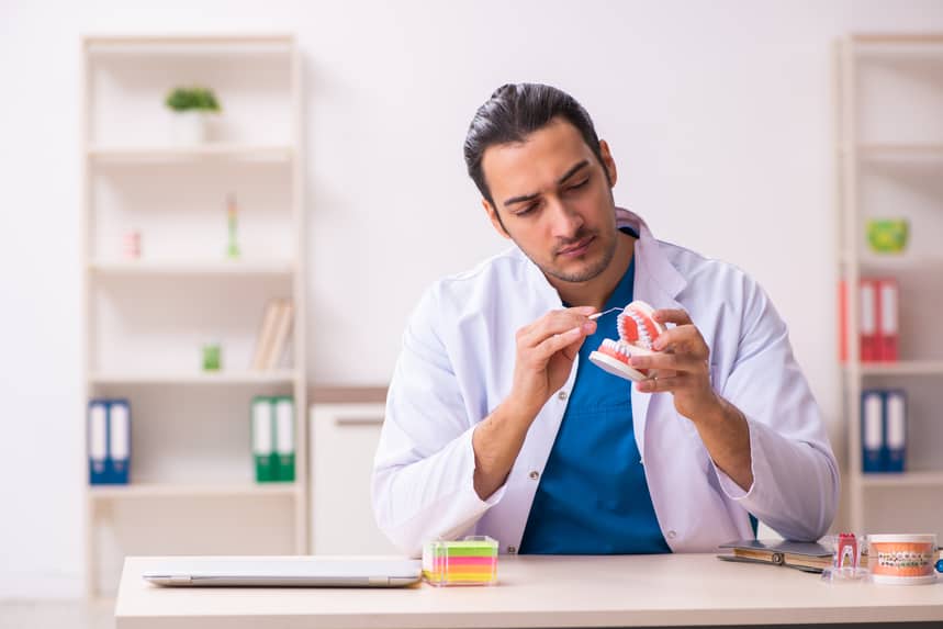 Man Pointing at Denture